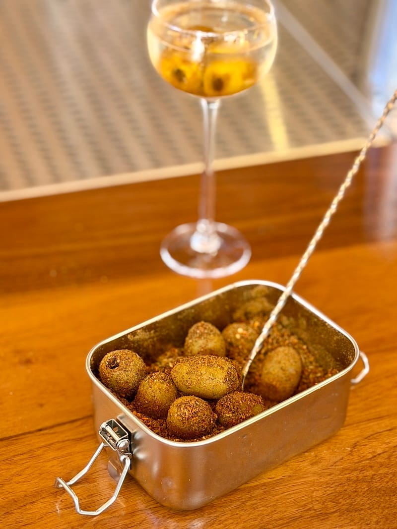 The togarashi and za’atar olives are going to be popular in and outside of your Yabani Martini. Photo: © tablehopper.com.