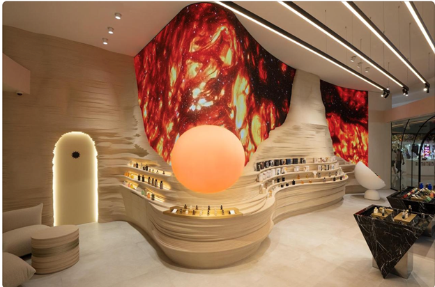 A room with a large orange ball on the wall

Description automatically generated