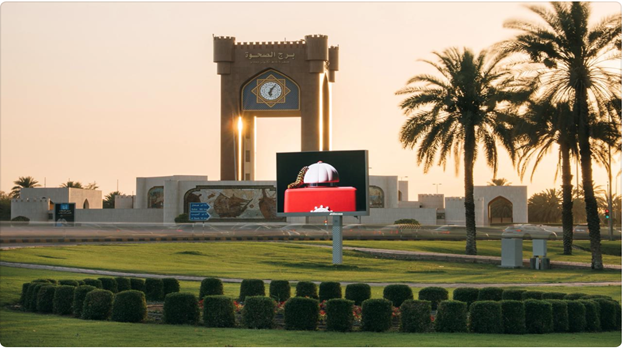 A large sign in front of a building

Description automatically generated