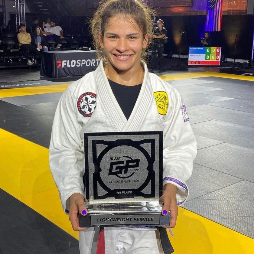 Janaina Lebre holds a first place trophy