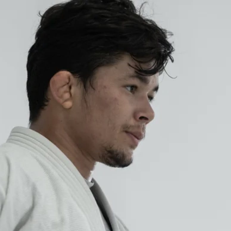 Thalison Soares in a white gi, in profile