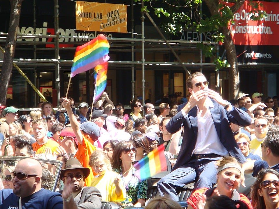 Newsom being held aloft at a 2007 gay pride parade during the early stages of his career.