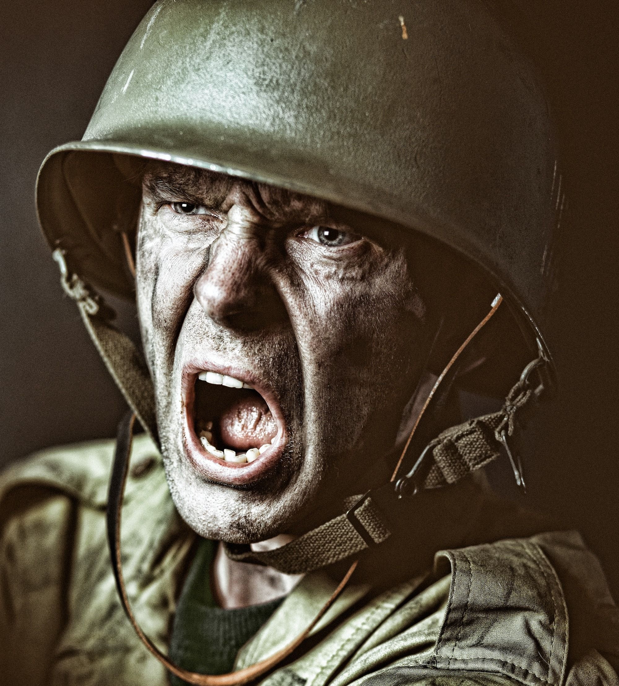 man in green zip up jacket wearing black helmet