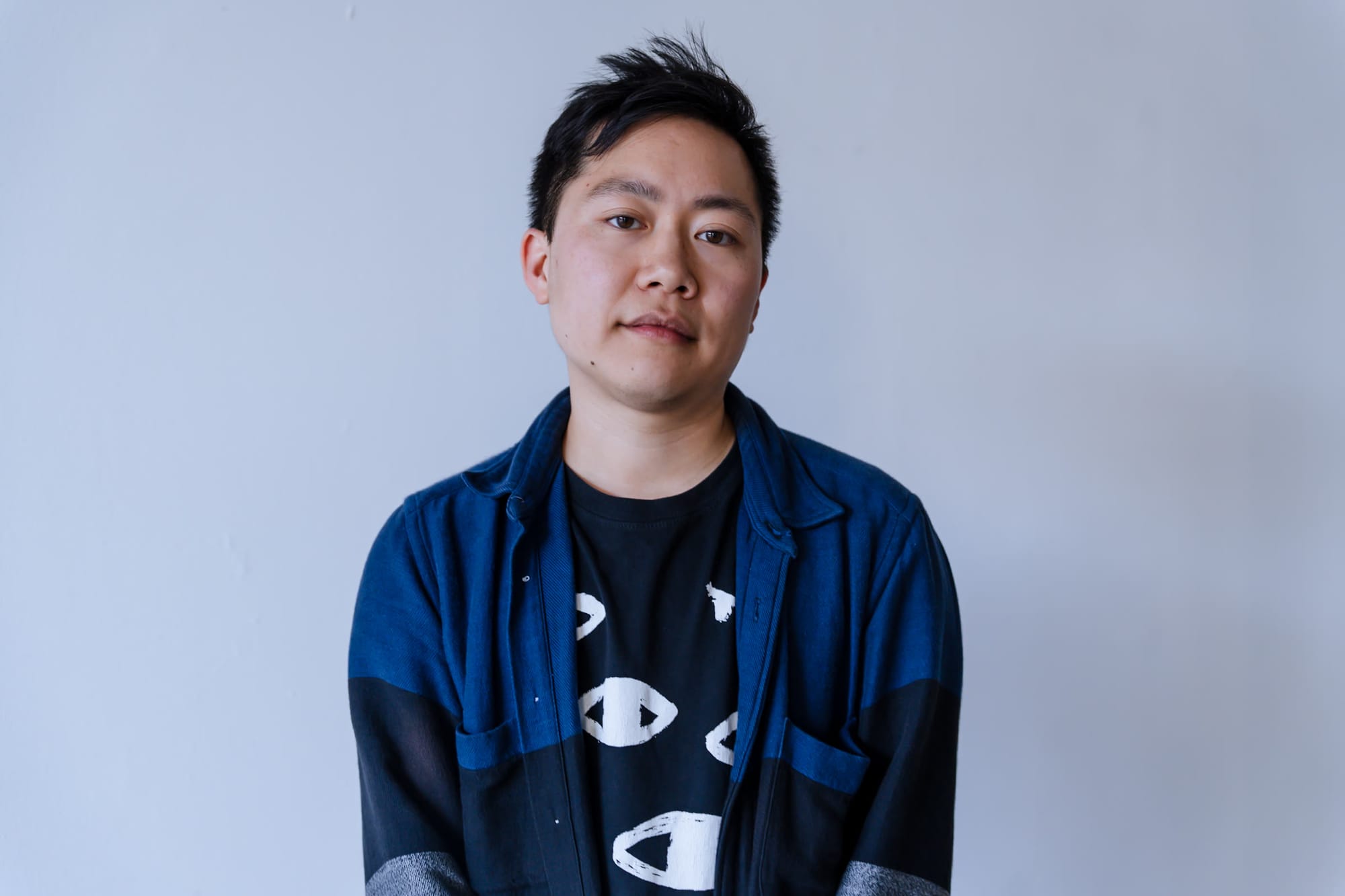 Portrait of Sagan Yee against a pale wall