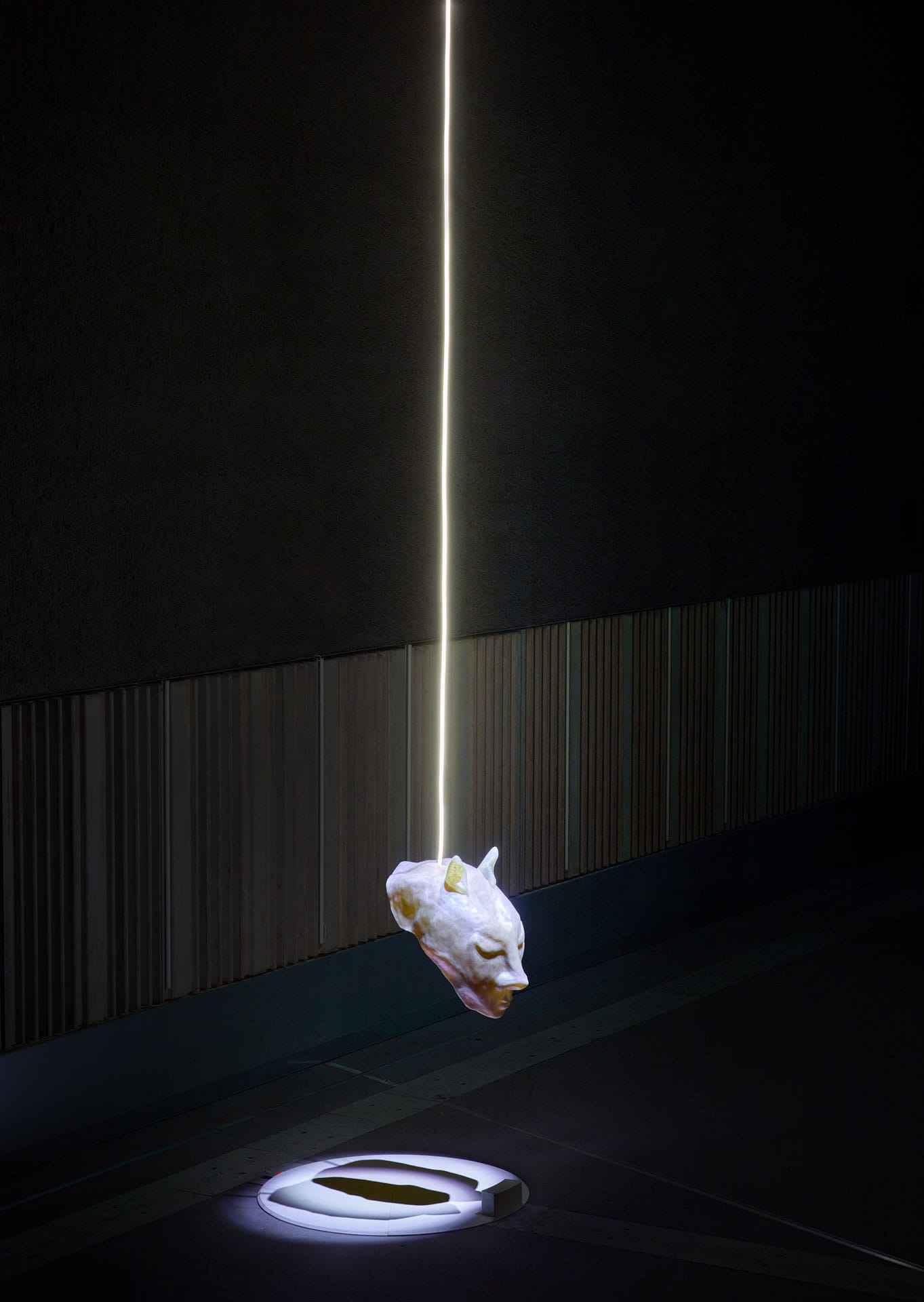 A visitor wearing Keiken's Divine Puppeteer mask