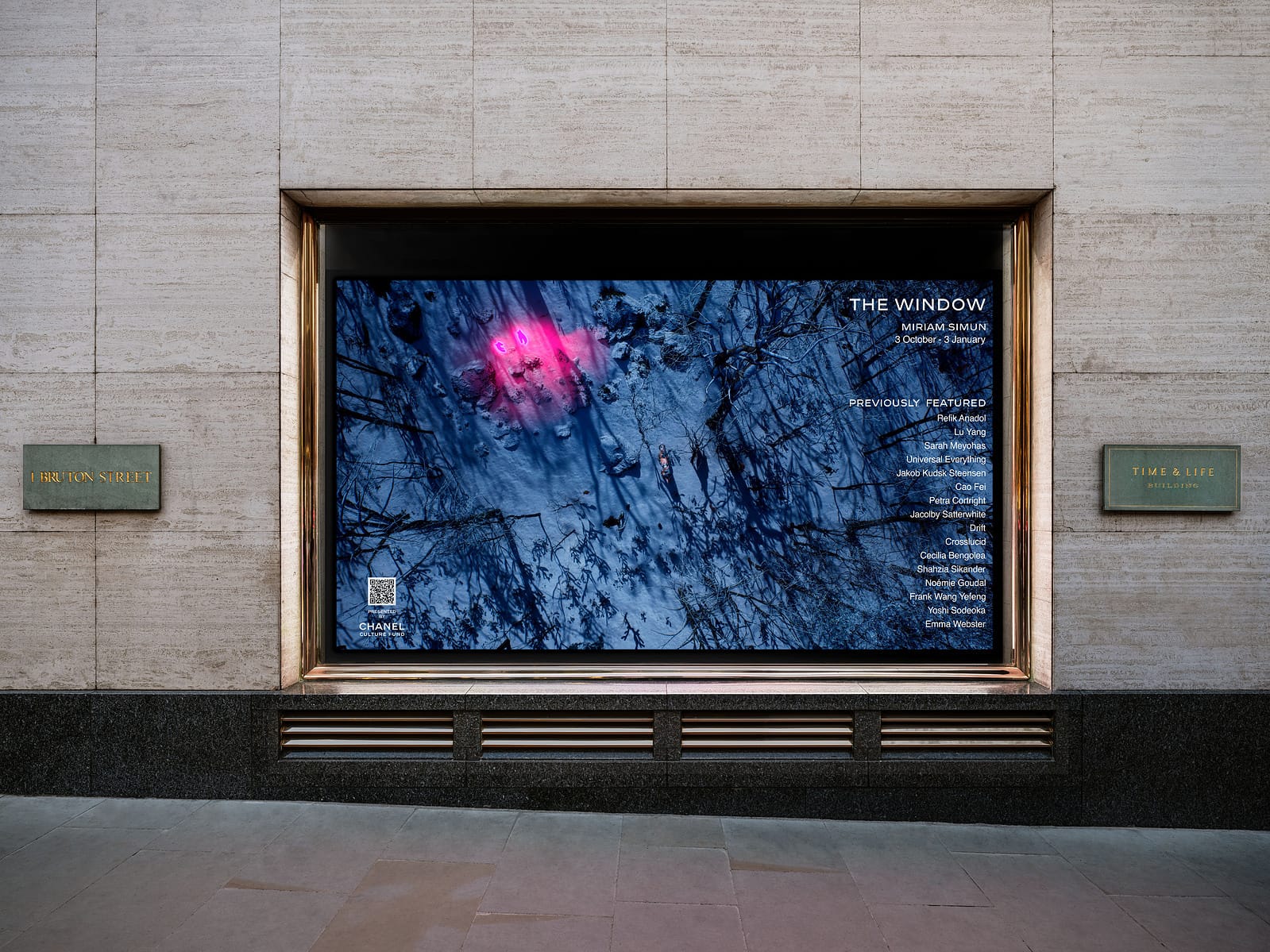 A rendering of a street-level window in a stone facade showing a blue forest scene from Contact Zone (Level 3).