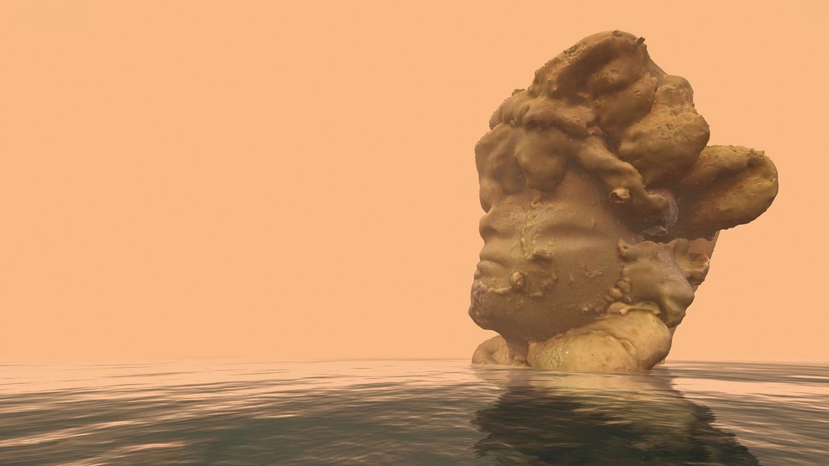 A colossal sculptural head stands in shallow water against an orange sky