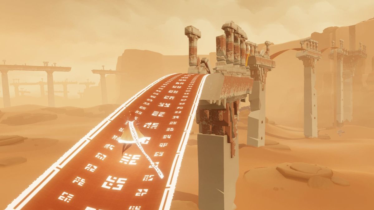 A robed figure crossing a vast sunlit desert of rippling sand dunes in Journey.