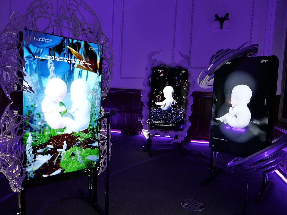 Installation view of Dreaming Babies: illi, screens showing simulated babies in virtual incubators