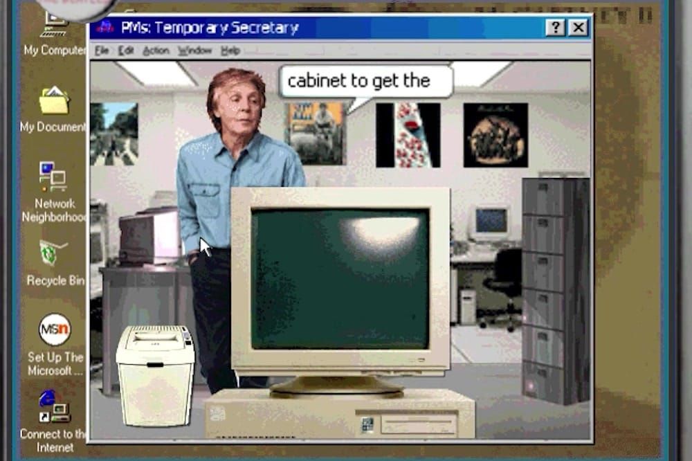 Paul McCartney stands beside a beige CRT in the office scene of Miles Buckle's imaginary CD-ROM Temporary Secretary