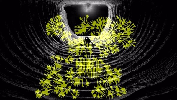A yellow slime mold spreads across the walls of a dark circular mine tunnel in the game NIBO.