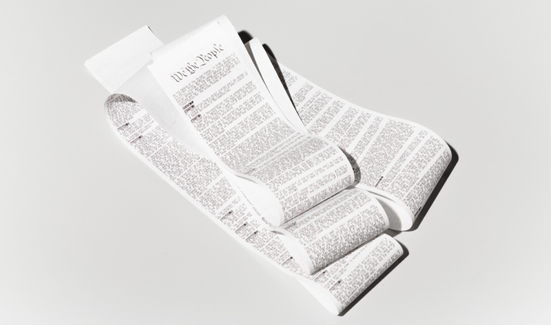 A hacktivist artist printing the US Constitution on a sales receipt