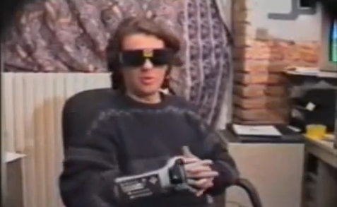 Watch a guy in a Power Glove demo the terrible virtual reality of the 90s