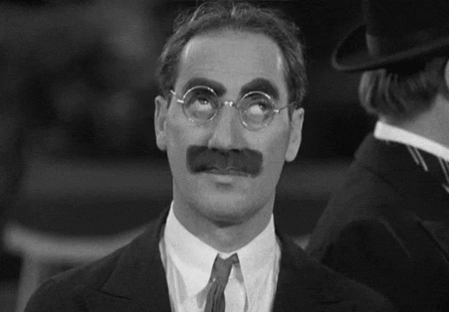 Grouch Marx rolling his eyes