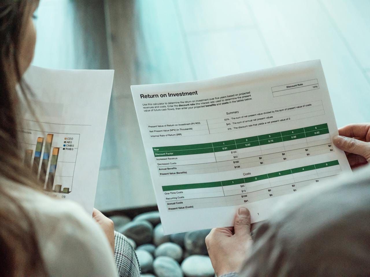 Two investors reviewing their return on their investments