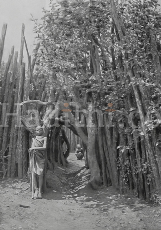 AN ENTRANCE TO A KIKUYU VILLAGE