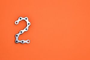 gray steel chain on orange surface
