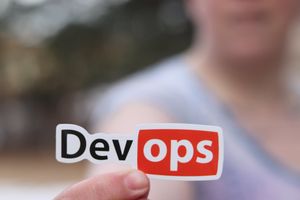 person holding a sticker