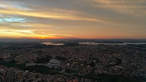 picturesque cityscape under cloudy sky on sundown