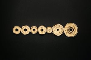 photo of golden cogwheel on black background