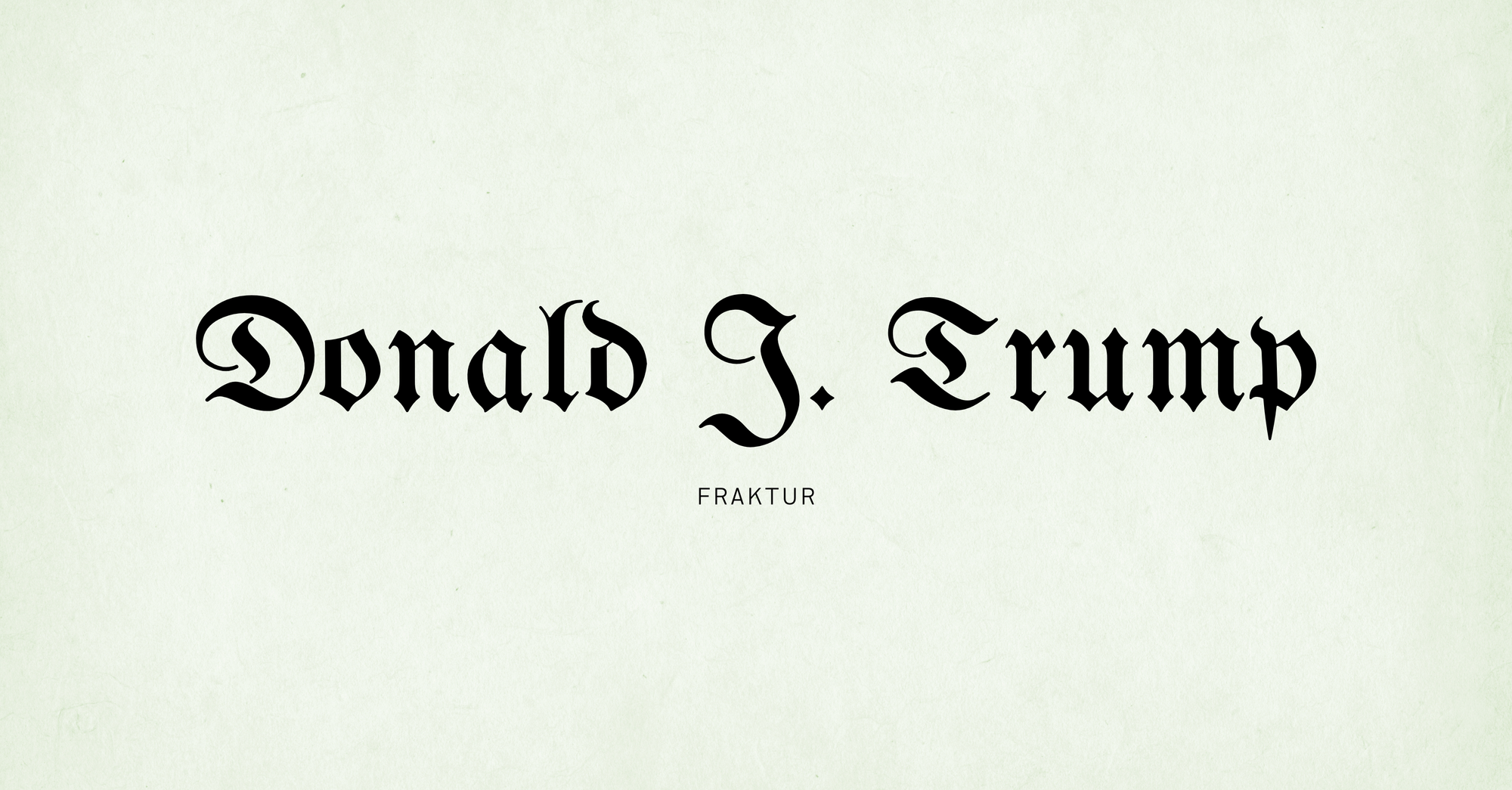 Texte « Donald J. Trump » écrit en noir dans une police gothique de type Fraktur, sur fond clair. Sous le nom, le mot « Fraktur » apparaît en lettres capitales.