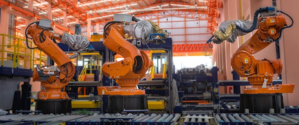 Robots welding in a production line