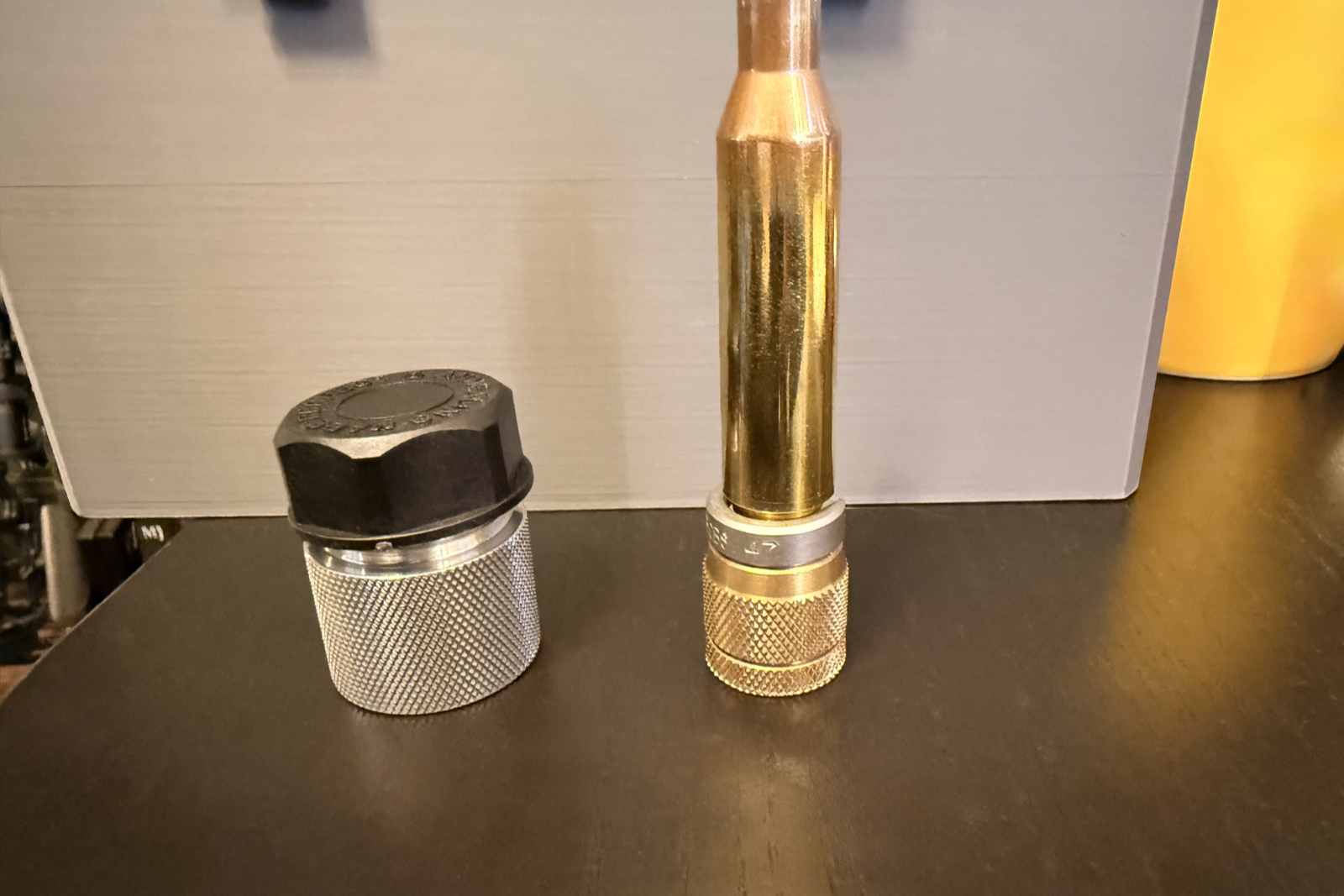 A .375 EnABELR case in an AMP brass shell-holder grip beside a separate No. 88 pilot.