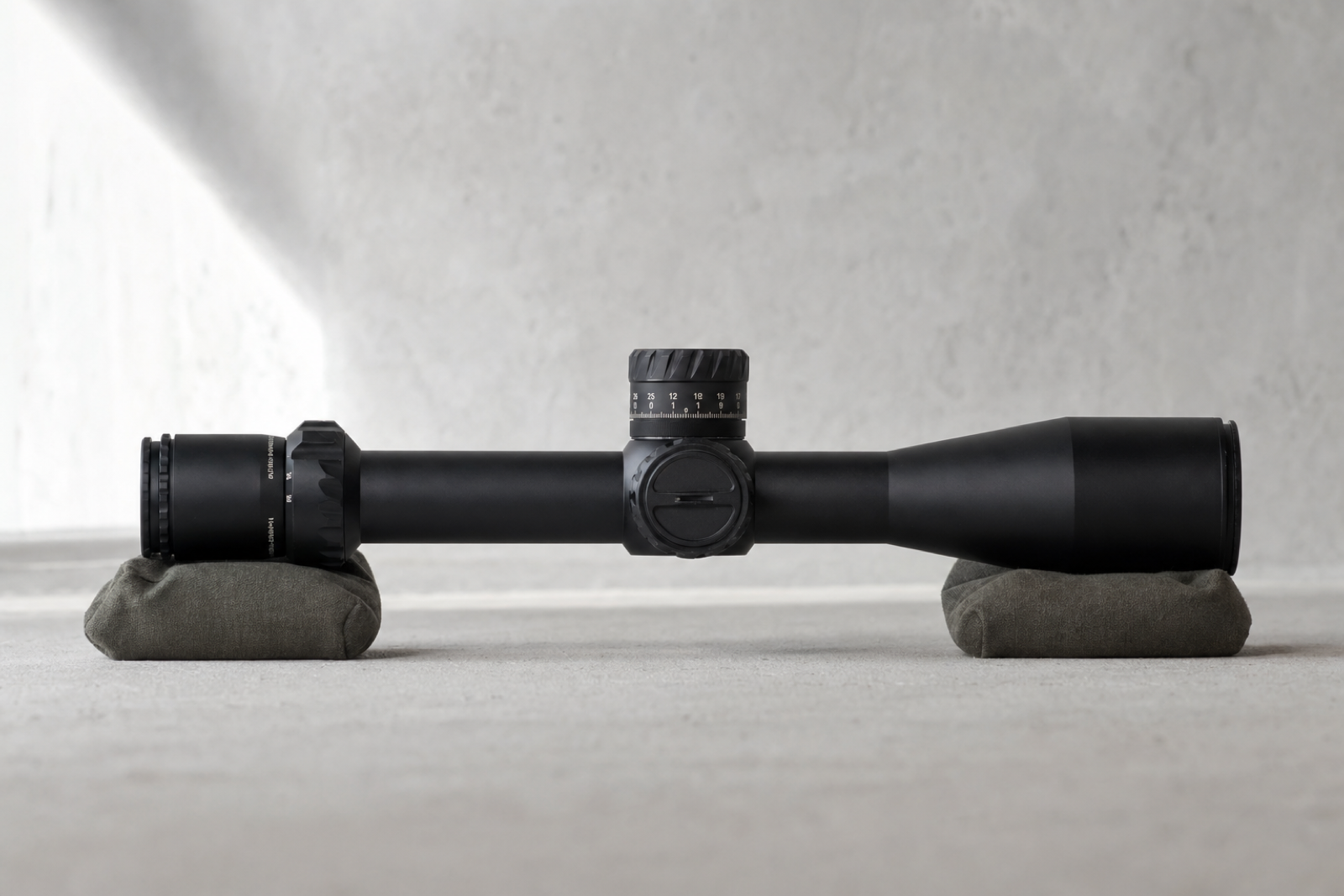 Complete side view of a black Tangent Theta TT525P optical instrument supported on a pale-grey surface.