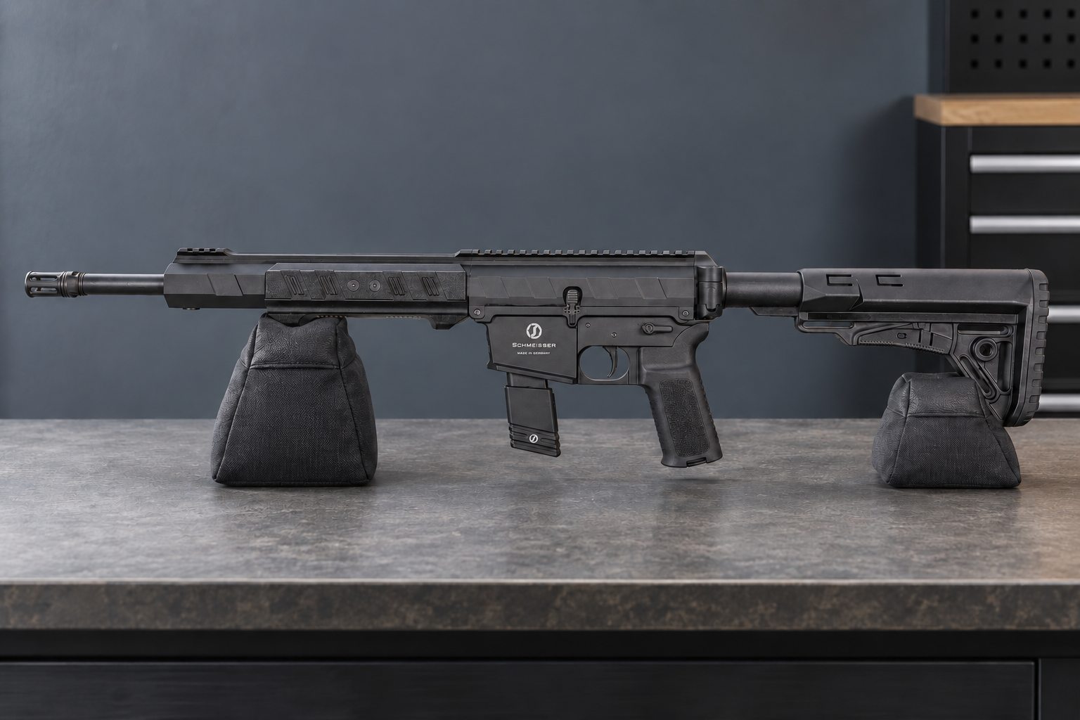 A Schmeisser PSR-9 rests horizontally on two padded supports, showing its left side and sliding fore-end.