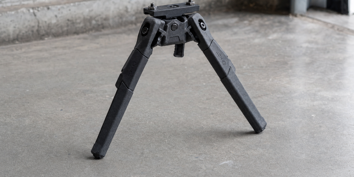 Illustrative black Oryx bipod with deployed legs and exposed M-LOK mounting head.