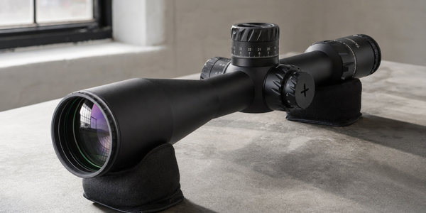 Front glass and connected black exterior of a Tangent Theta TT525P, resting on padded supports in side-window light.