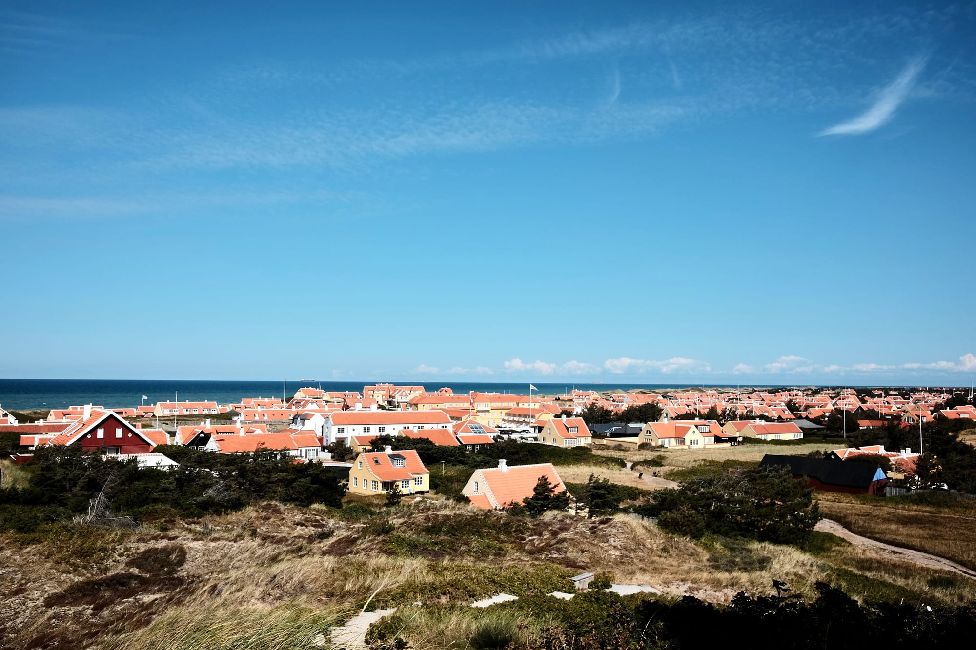 The old town area of Skagen in Denmark, with its distintive yellow houses and their orange-tiled roofs.