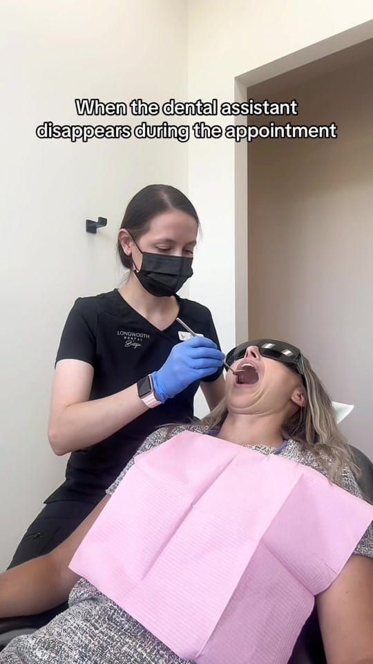 A Longworth Dental Courtice assistant using a mirror instrument on a patient wearing shade glasses, with on-screen text reading: when the dental assistant disappears during the appointment.