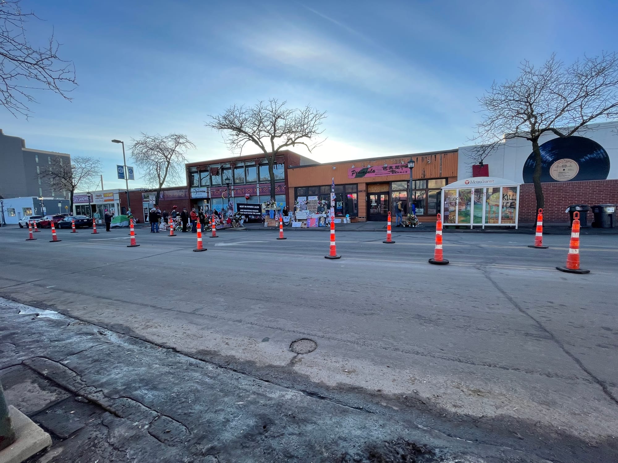 A photo featuring the memorial for Alex Pretti on Nicollet Avenue in Minneapolis
