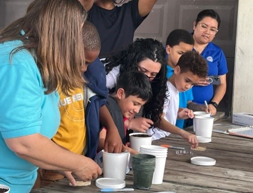 A group of people at a table

AI-generated content may be incorrect.