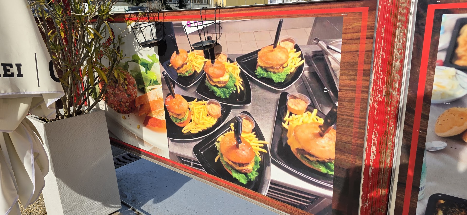 Affiche de plusieurs hamburgers chez New Adoc.