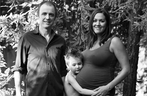 Our little family standing by our redwood tree