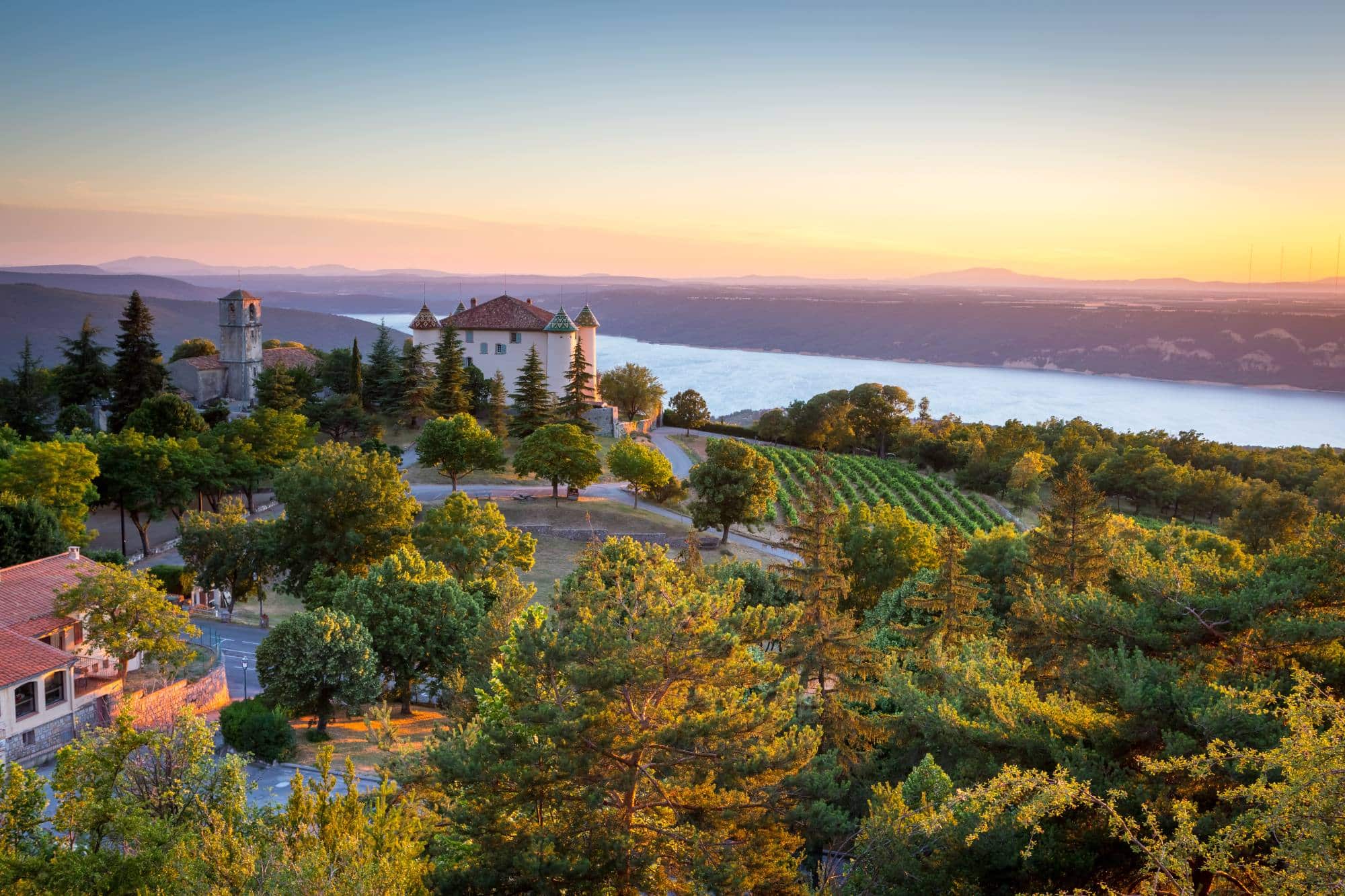 The village of Aiguines village with charming chateau and church overlooking Lac de Sainte Croix Lake, Var department, Provence, France