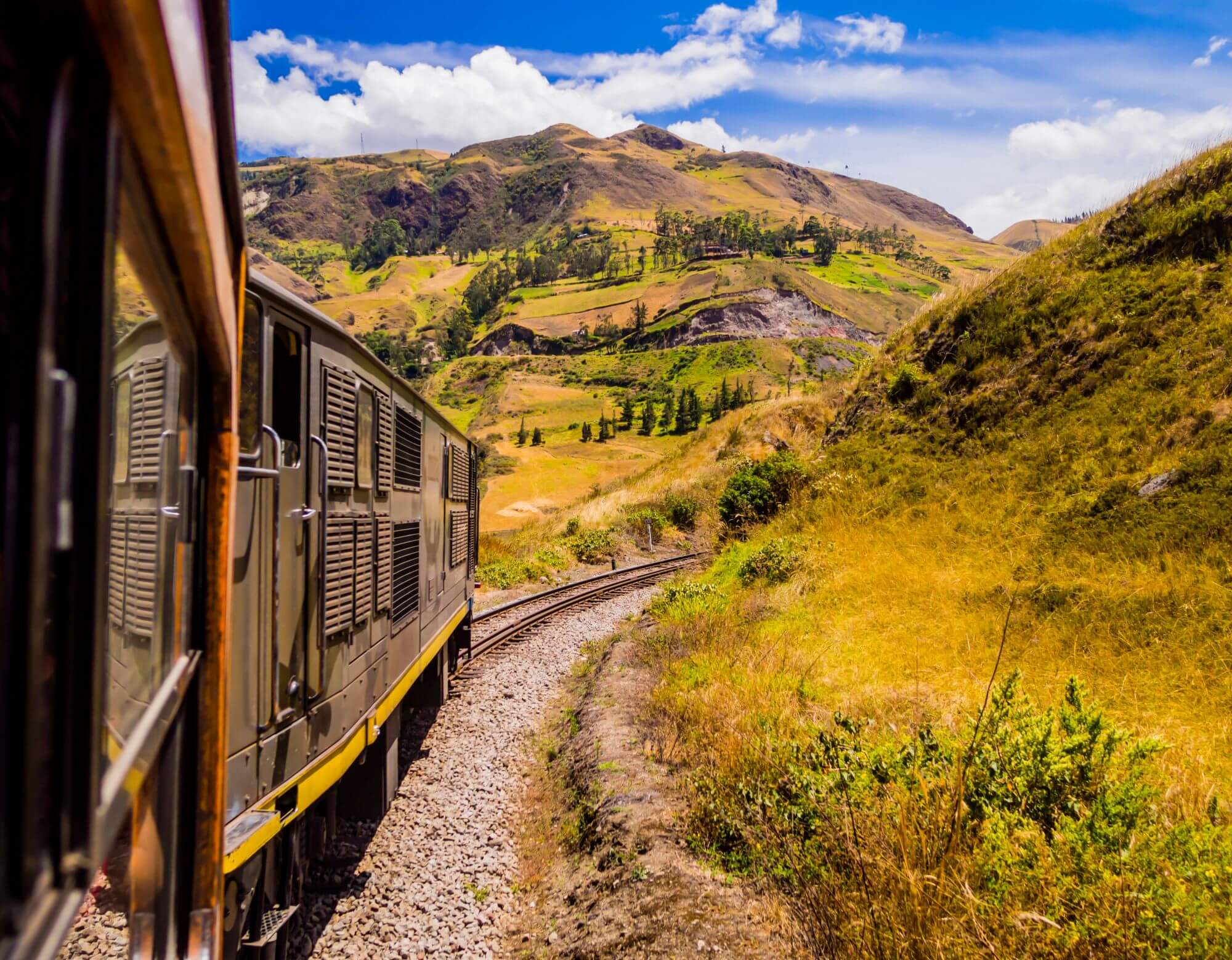 Devil's Nose train running on beautiful Andean landscape, Alausi, Ecuador