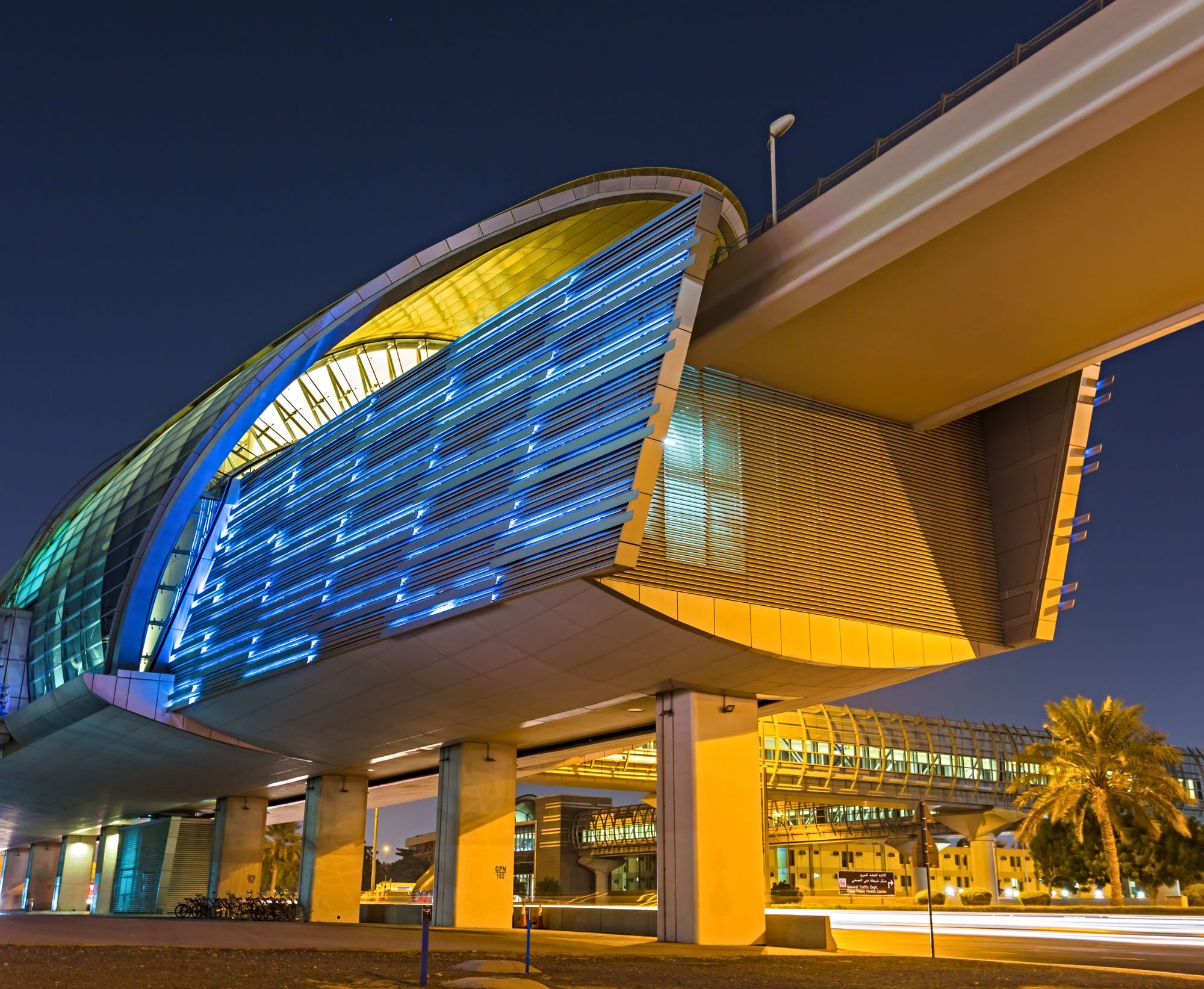 Dubai metro line at night - a modern and futuristic buildng