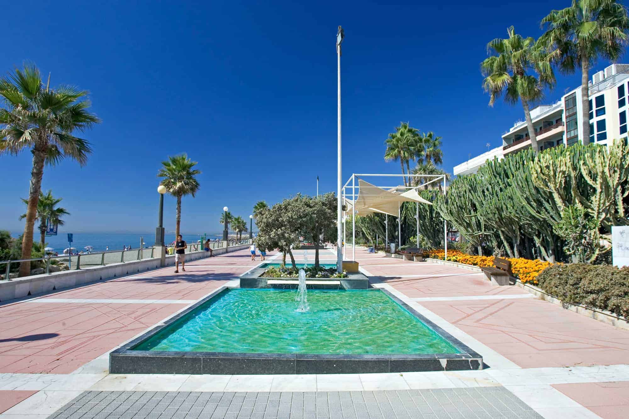 The promenade in Estepona with palms and fountains