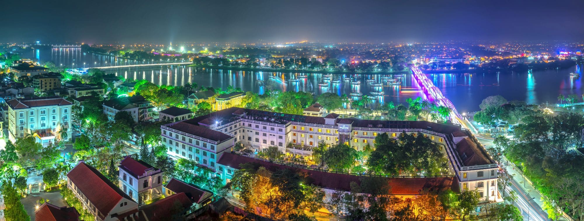 A night view of a brightly lit city of Hue in Vietnam 