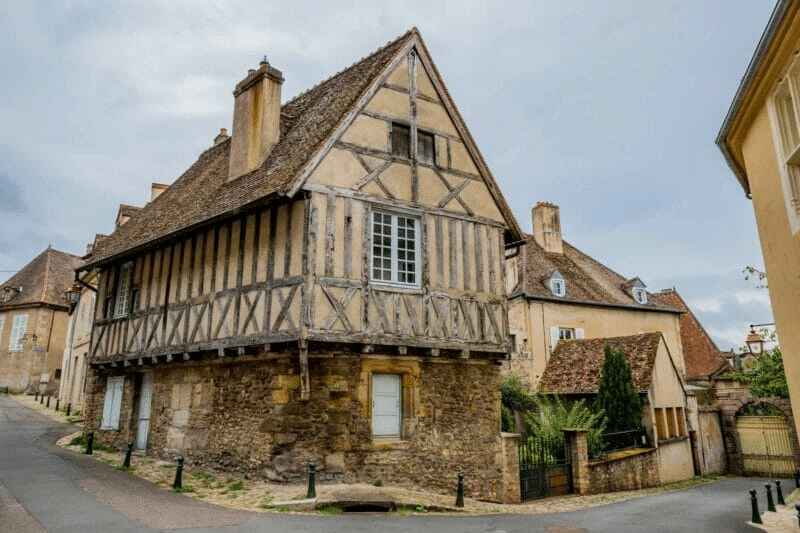 An old house with wooden beams  and steep roof in Saône-et-Loire