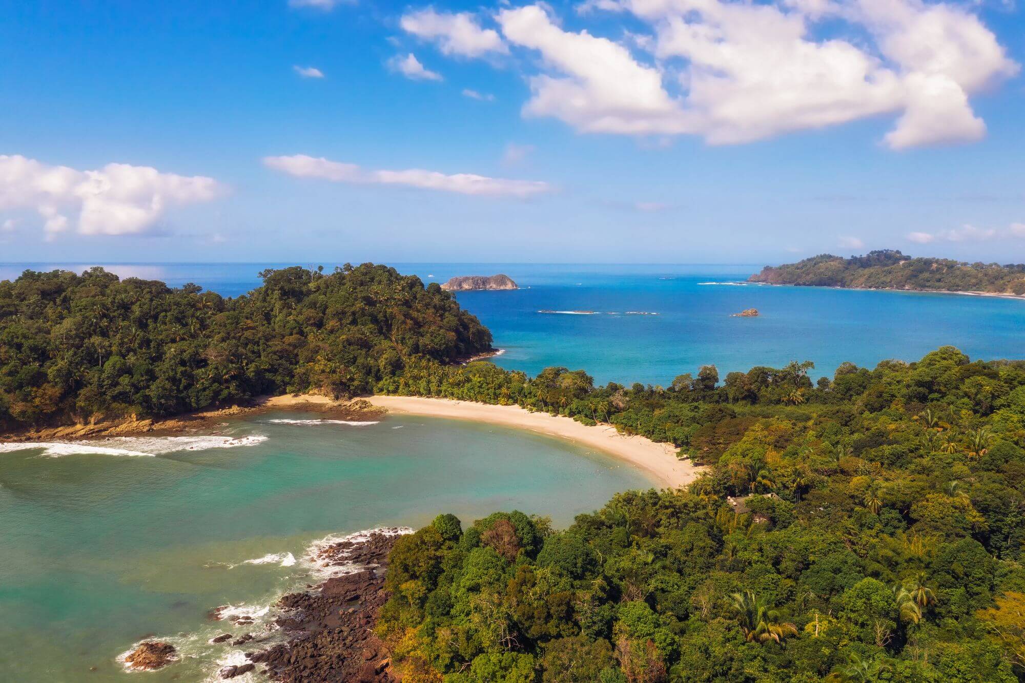 A drone view of the coast of manual Antonio national Park