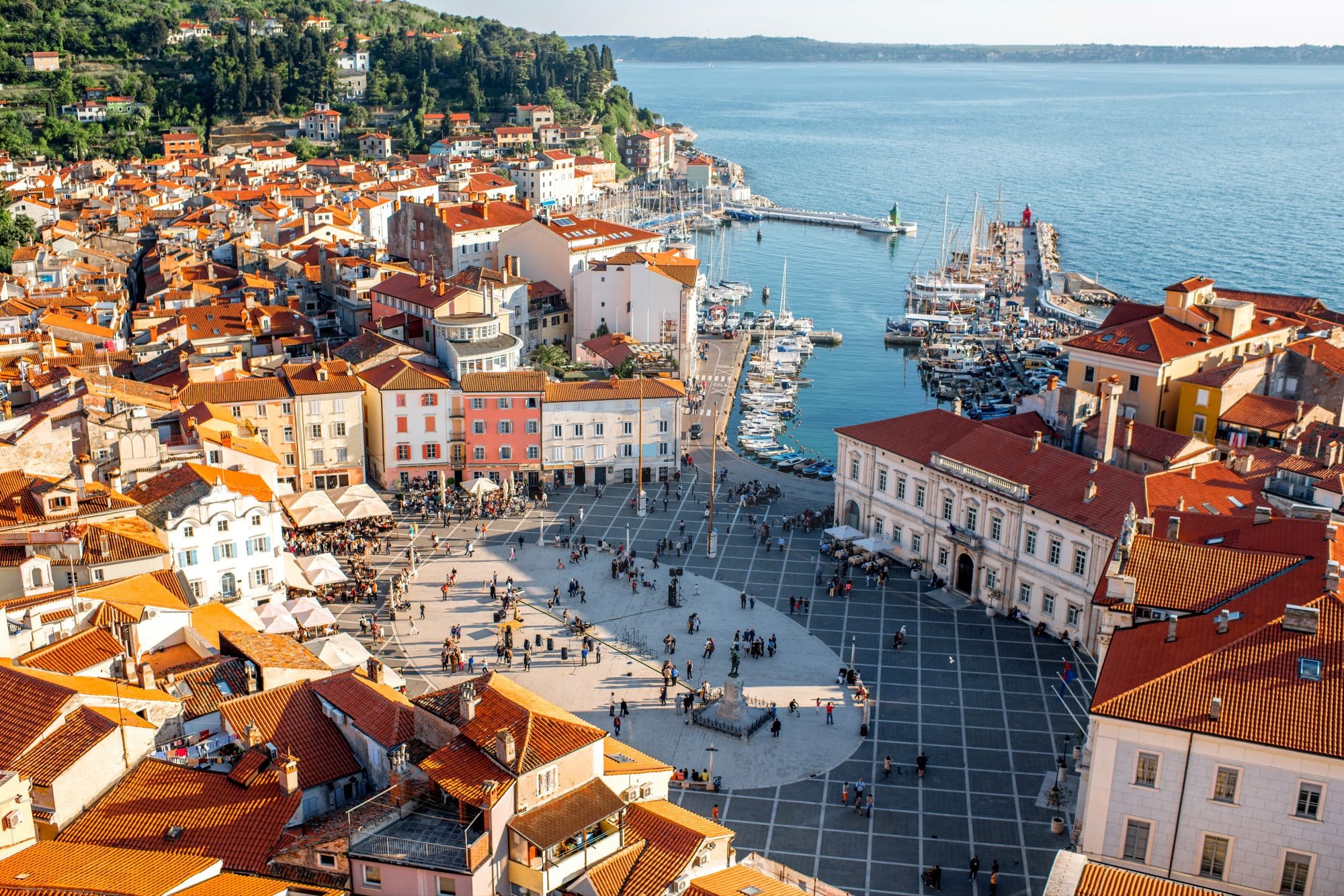 Beautiful aerial view on Piran town with Tartini main square, ancient buildings with red roofs and Adriatic sea in southwestern Slovenia
