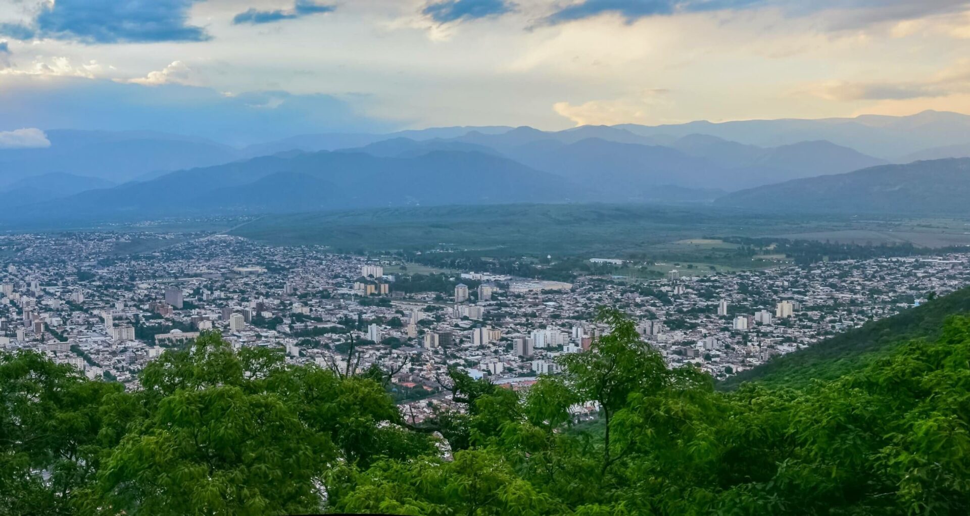 Salta, Argentina - a panoramic view of the city from the hill surrounded by green forests