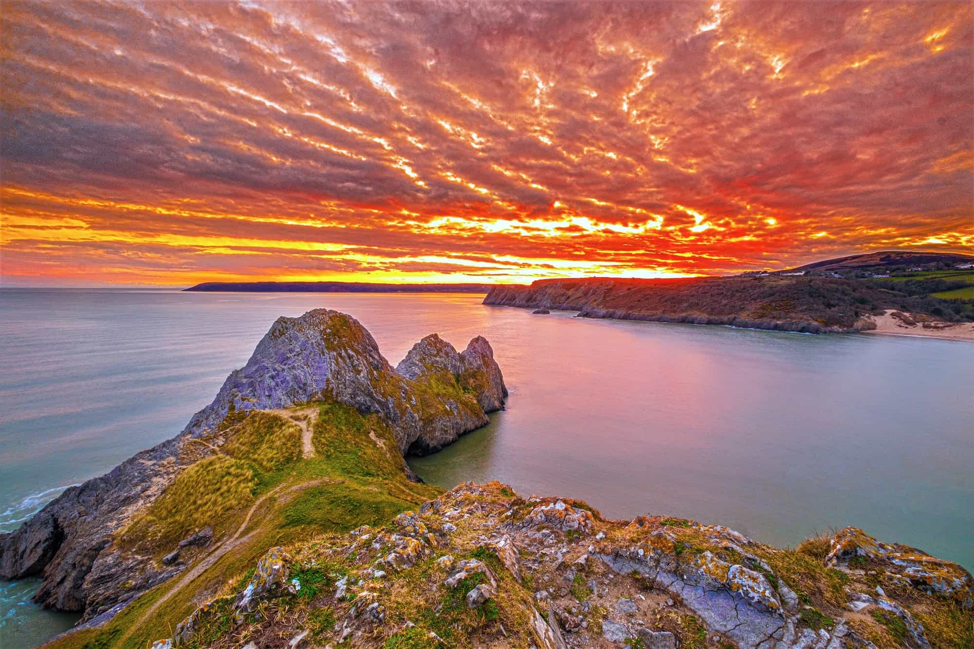 The Gower at the sunset - golden skies reflecting in the water