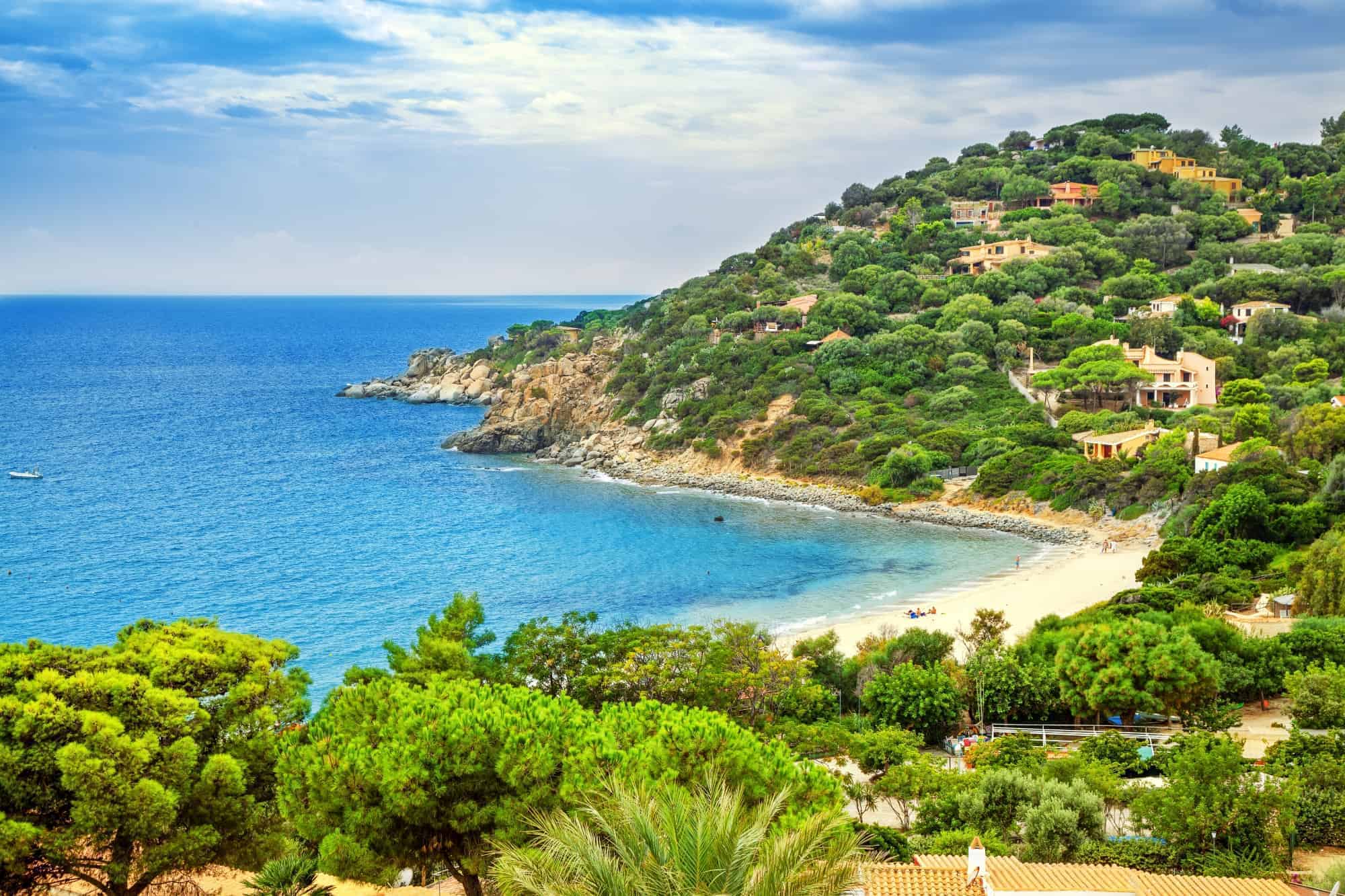 Sardinia coastline with sandy beaches and green hills