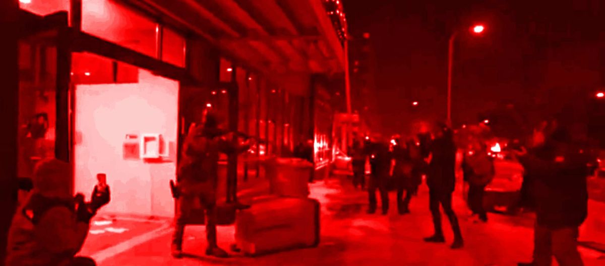 An FPS agent brandishing their firearm at members of the press outside a hotel in downtown Minneapolis where ICE and Border Patrol agents were staying the night of January 25th, 2026.