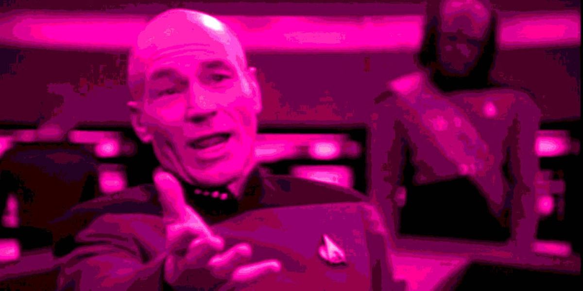 Captain Jean Luc Picard reaching out his hand towards the viewer, a pleading look in his face with Worf looking puzzled standing behind him some feet away.